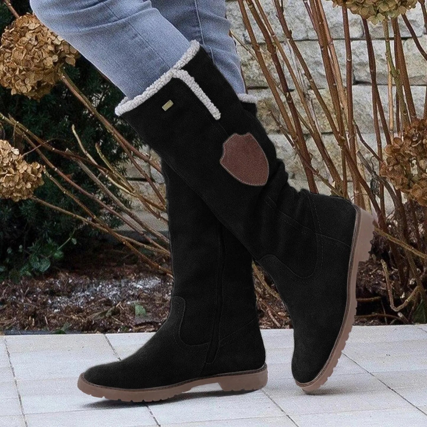 Bottes femme hauteur genou à bordure en peau lainée