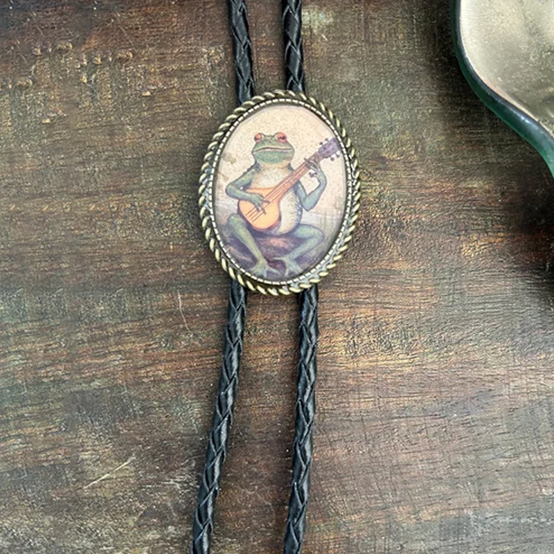 Cravate bolo motif grenouille au banjo
