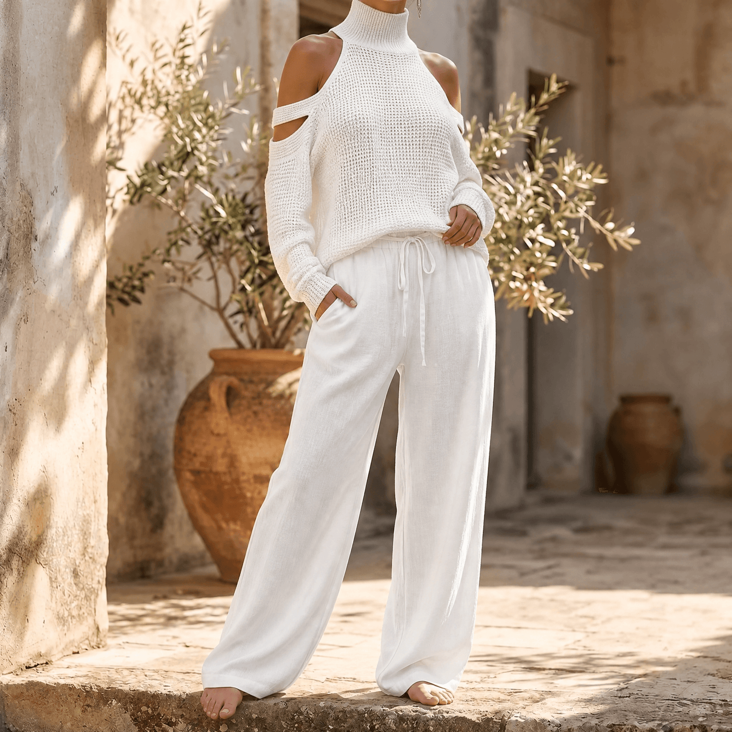 Ensemble femme pull en maille à épaules dénudées et pantalon à jambes larges