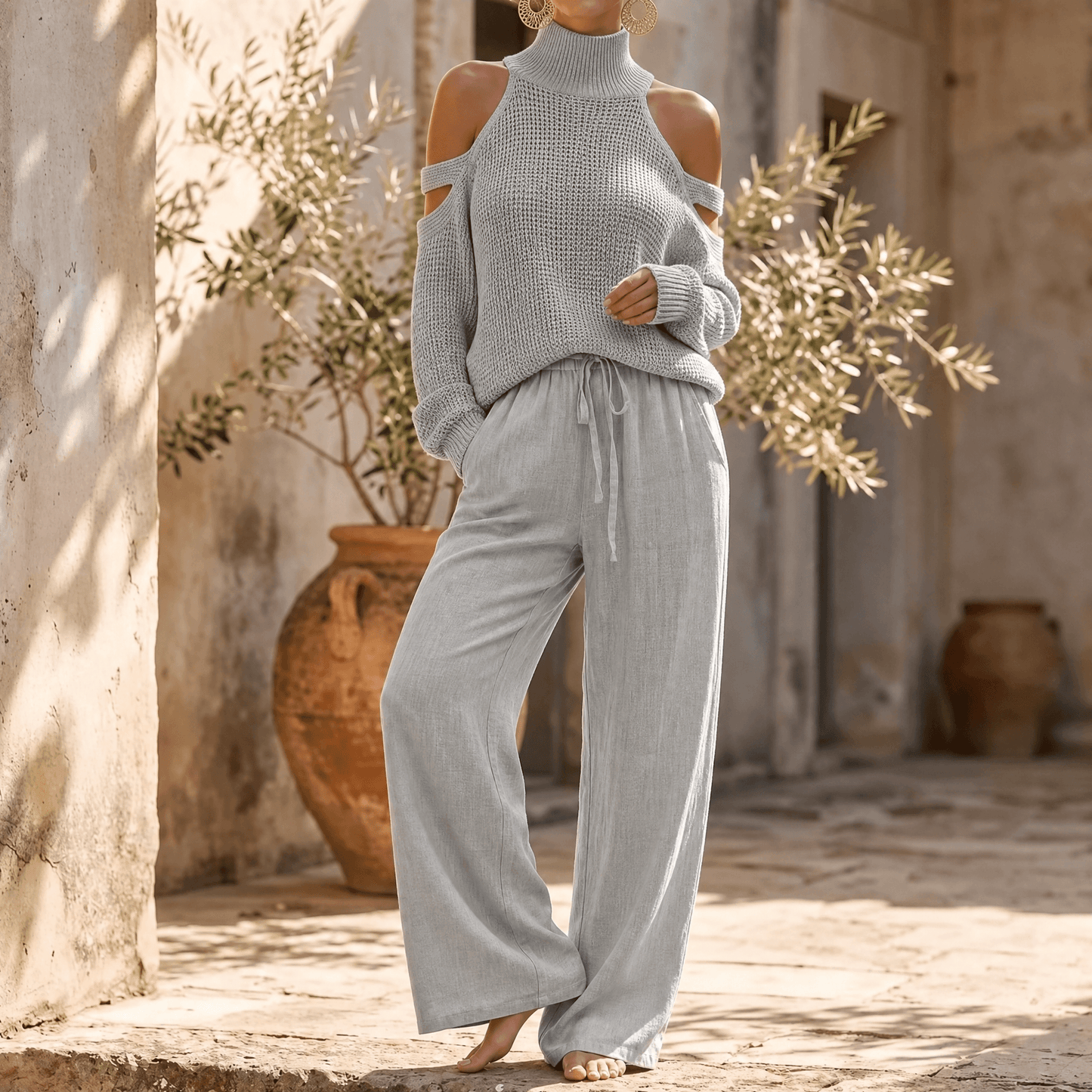 Ensemble femme pull en maille à épaules dénudées et pantalon à jambes larges