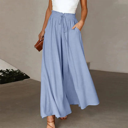 Pantalon taille haute, ceinture élastiquée avec cordon de serrage – coupe évasée – avec poches – long et aérien