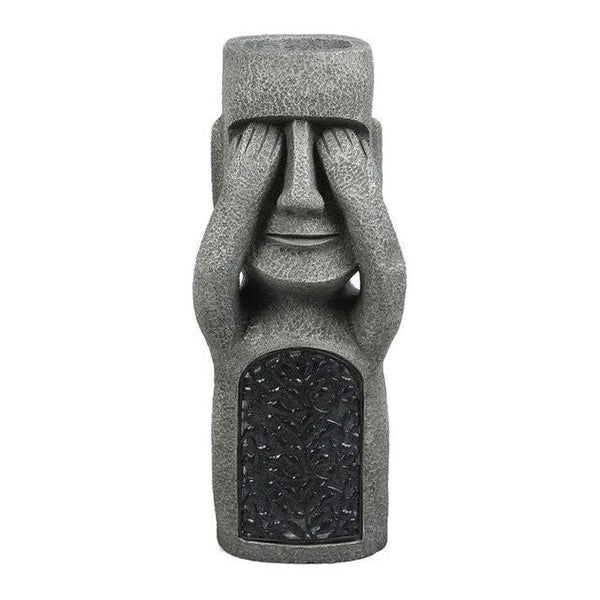 Pot de fleurs à visage sculpté
