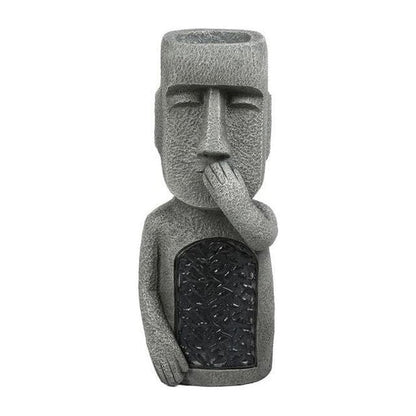 Pot de fleurs à visage sculpté
