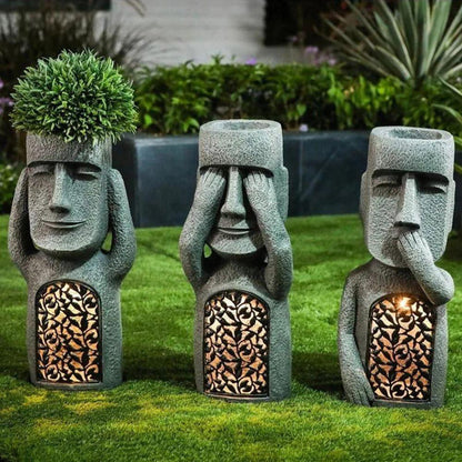 Pot de fleurs à visage sculpté