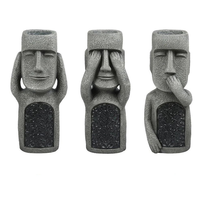 Pot de fleurs à visage sculpté