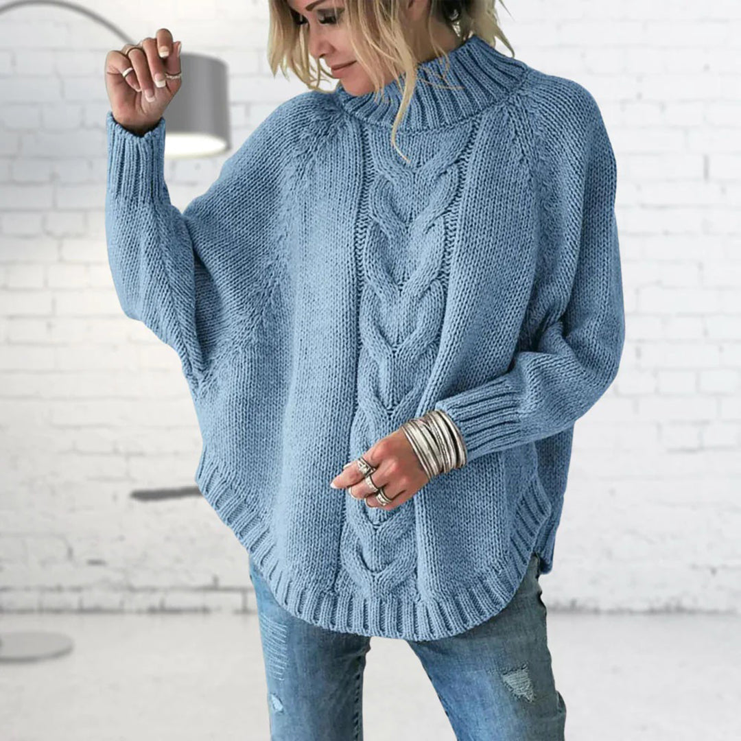 Pull femme à col roulé en maille torsadée