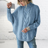 Pull femme à col roulé en maille torsadée