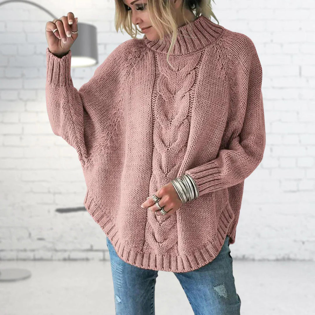 Pull femme à col roulé en maille torsadée