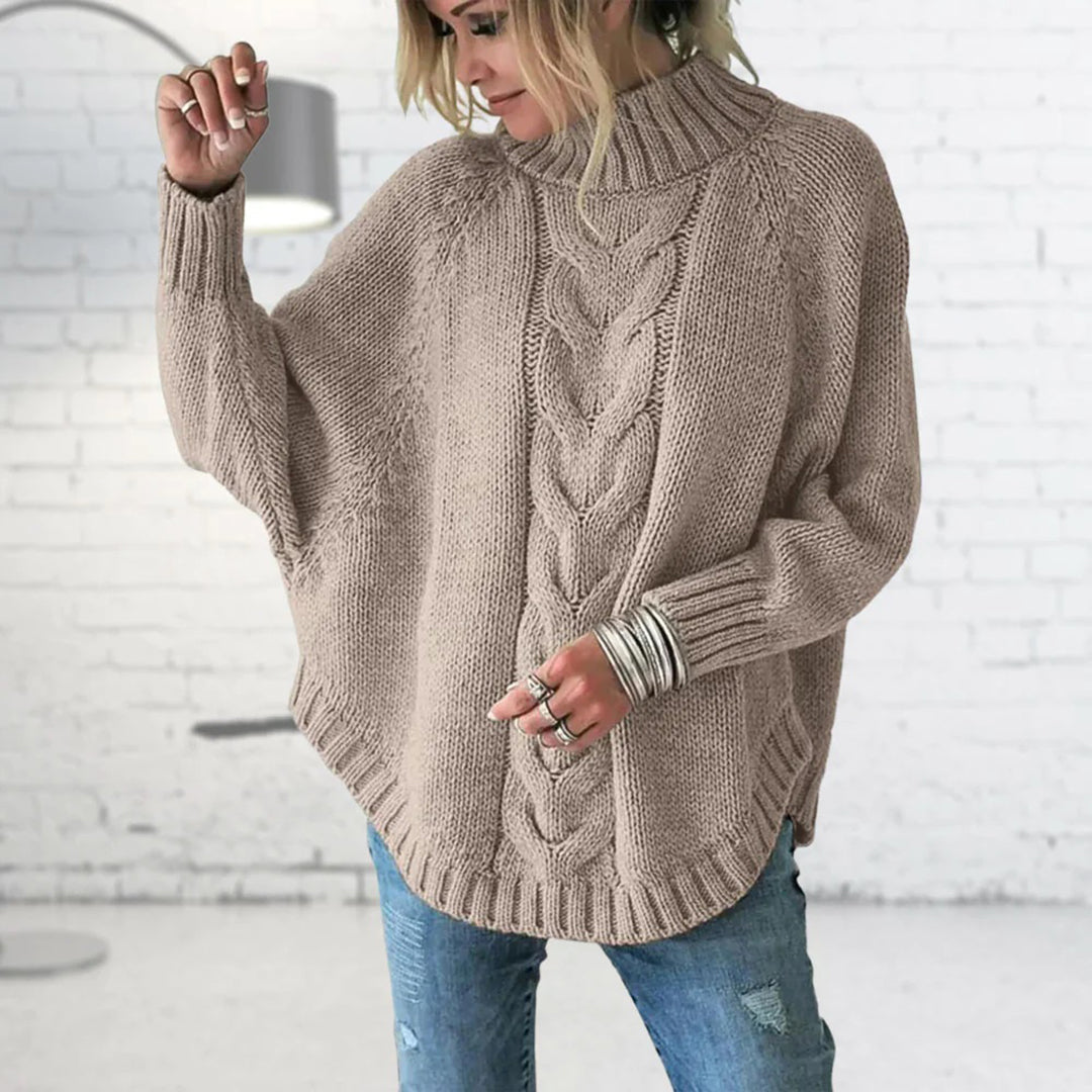 Pull femme à col roulé en maille torsadée