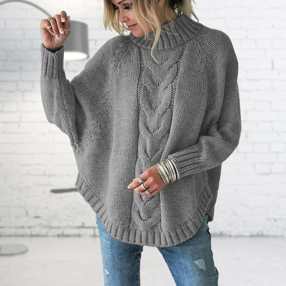 Pull femme à col roulé en maille torsadée