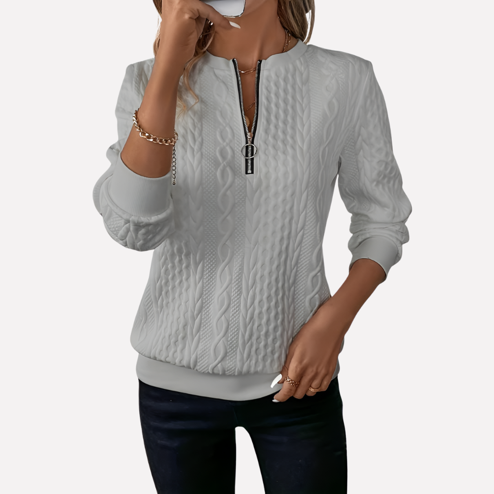 Pull femme en maille torsadée à col zippé