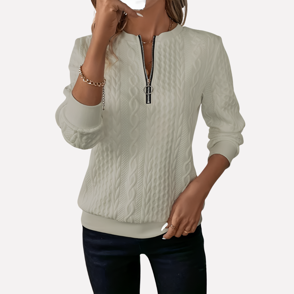 Pull femme en maille torsadée à col zippé