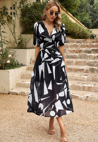Robe midi élégante à fleurs à manches bouffantes