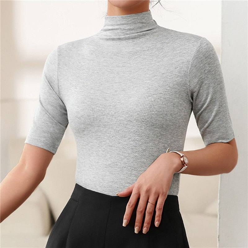 Top femme ajusté à col roulé, manches au coude