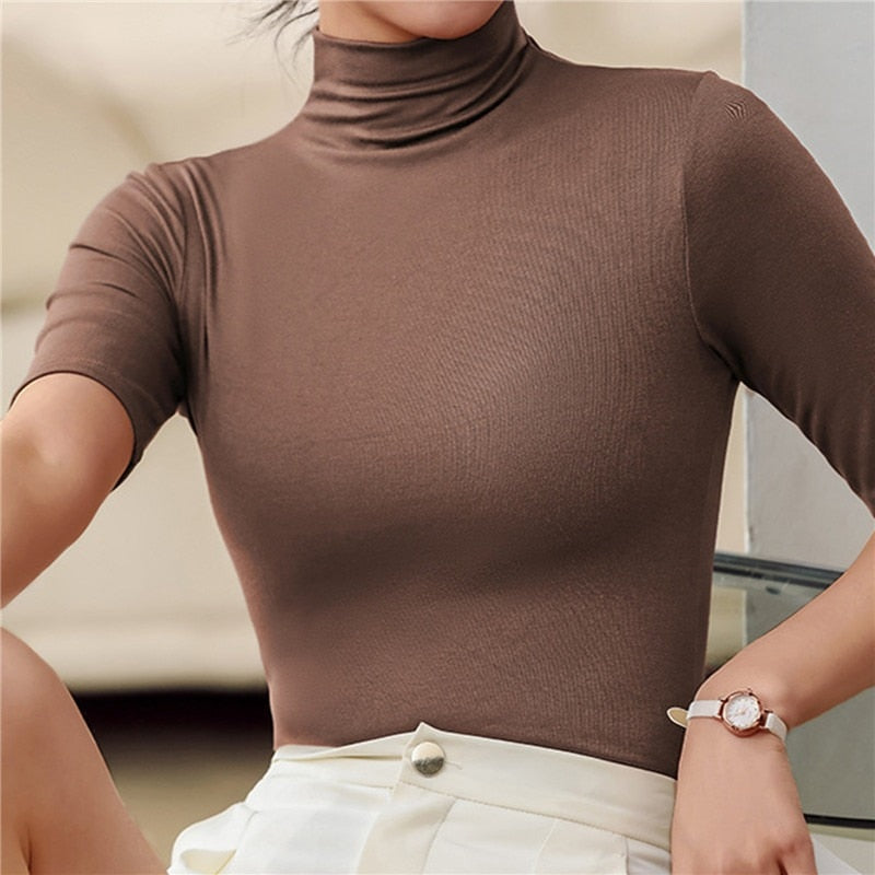 Top femme ajusté à col roulé, manches au coude