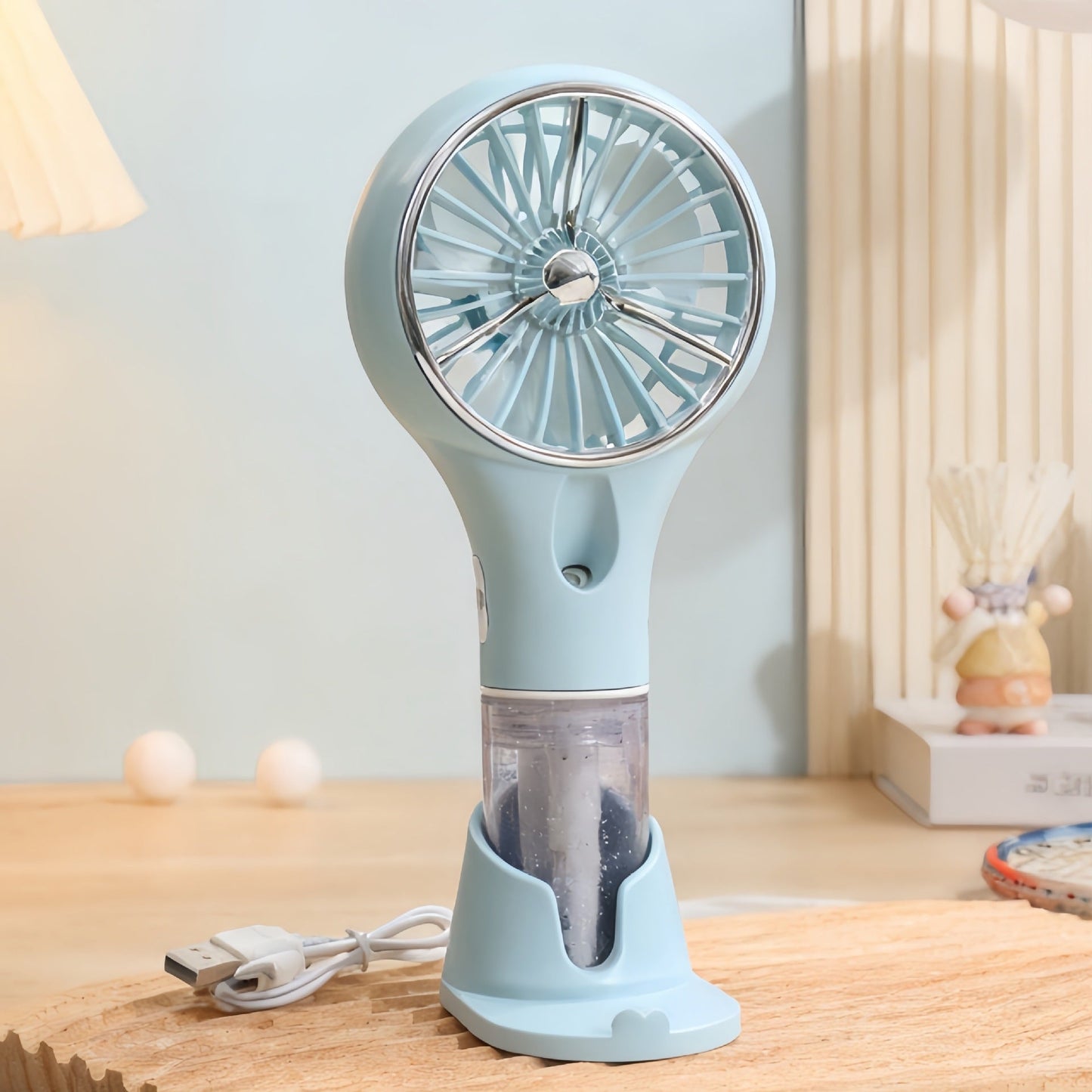 Ventilateur à main brumisateur portable unisexe avec fonction de charge USB et design ergonomique