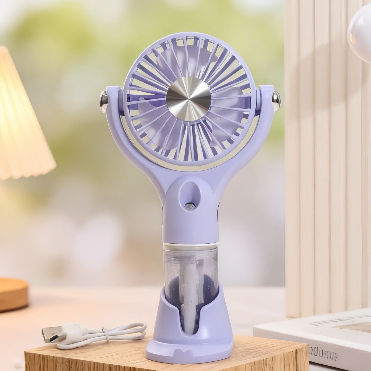 Ventilateur à main brumisateur portable unisexe avec fonction de charge USB et design ergonomique