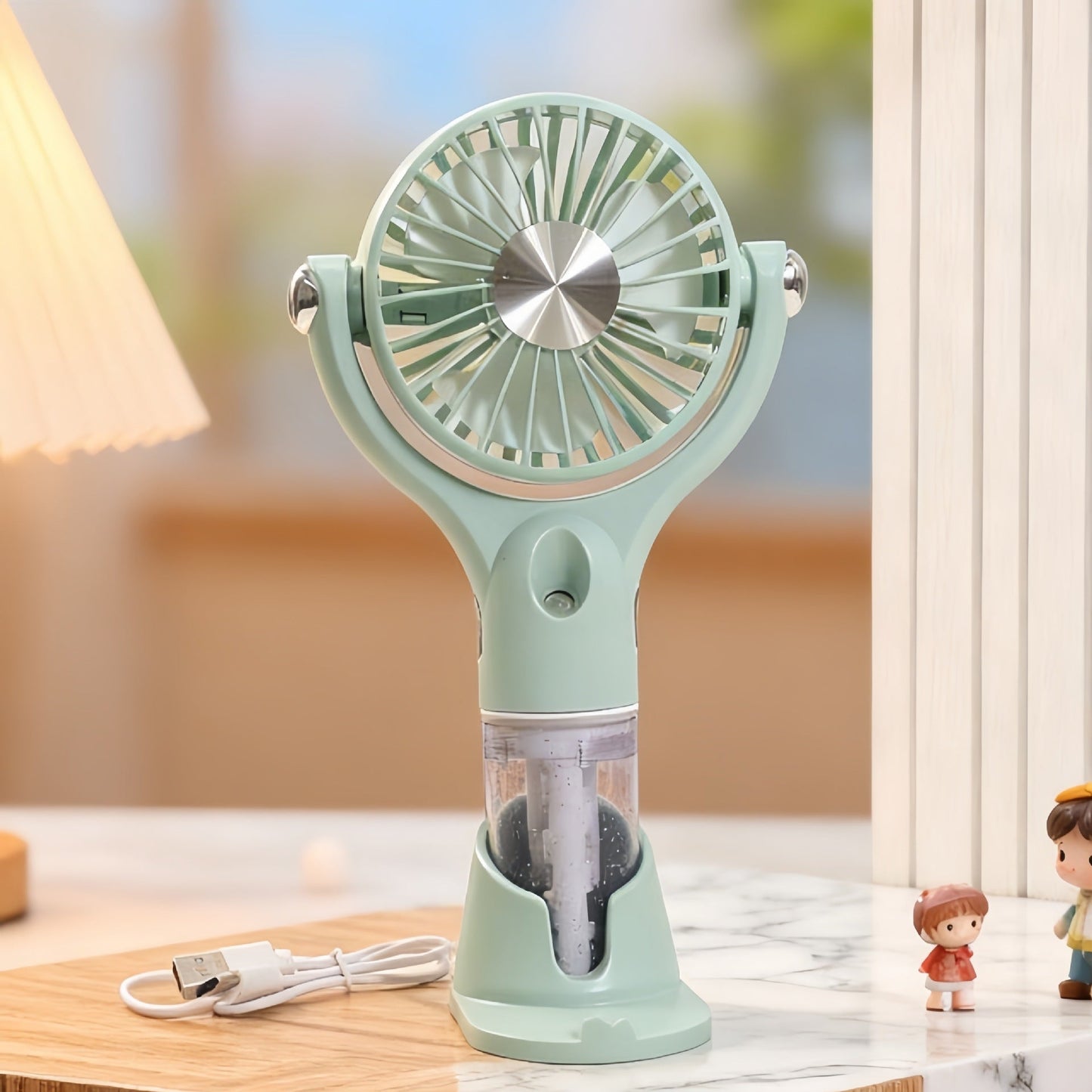 Ventilateur à main brumisateur portable unisexe avec fonction de charge USB et design ergonomique