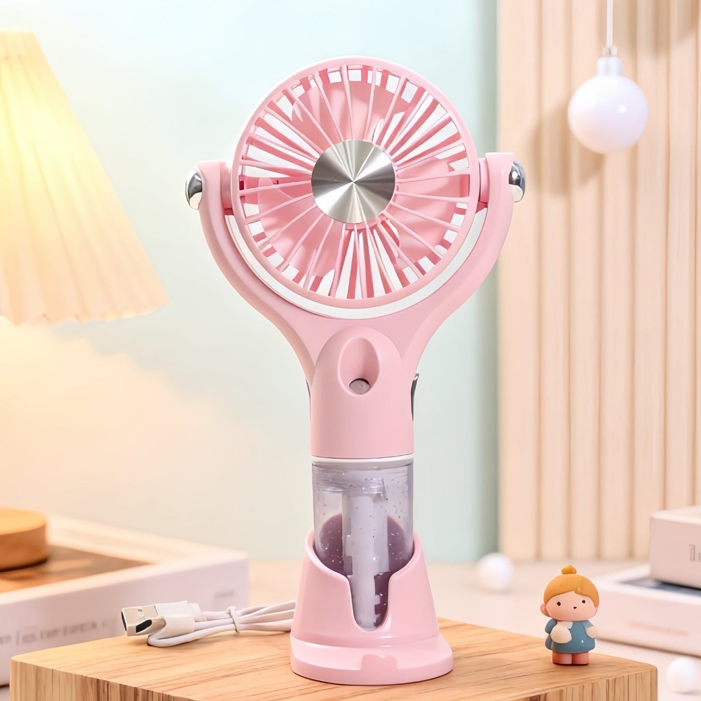 Ventilateur à main brumisateur portable unisexe avec fonction de charge USB et design ergonomique
