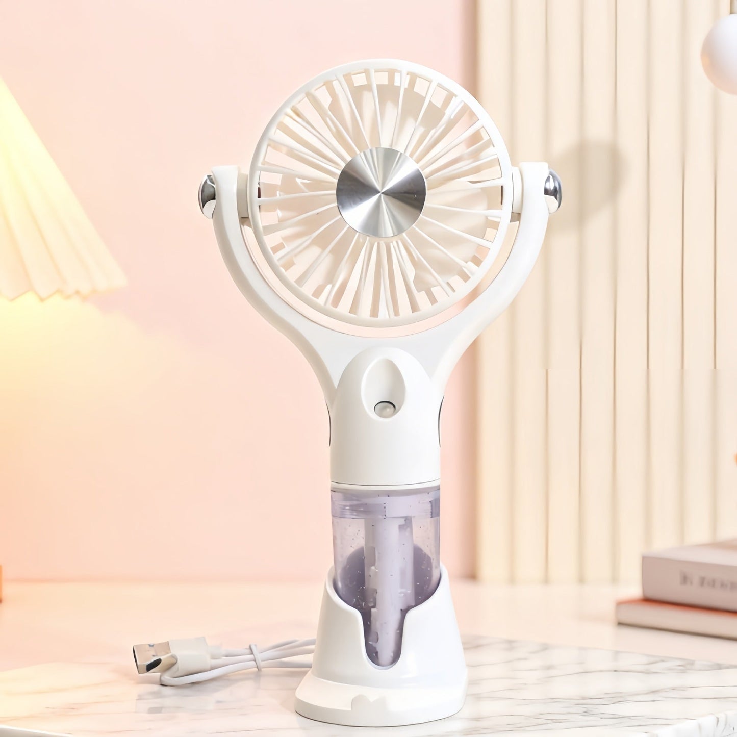 Ventilateur à main brumisateur portable unisexe avec fonction de charge USB et design ergonomique