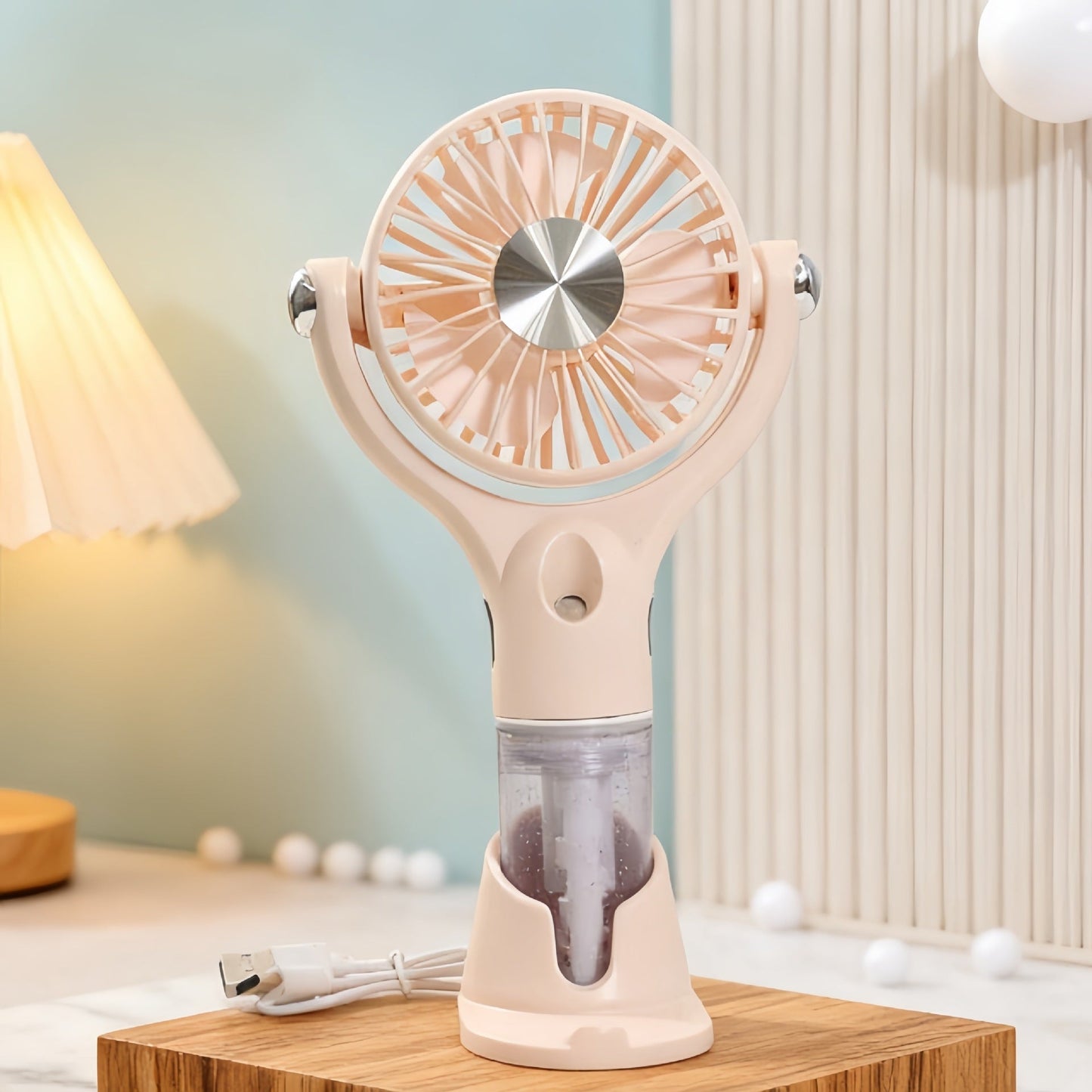 Ventilateur à main brumisateur portable unisexe avec fonction de charge USB et design ergonomique