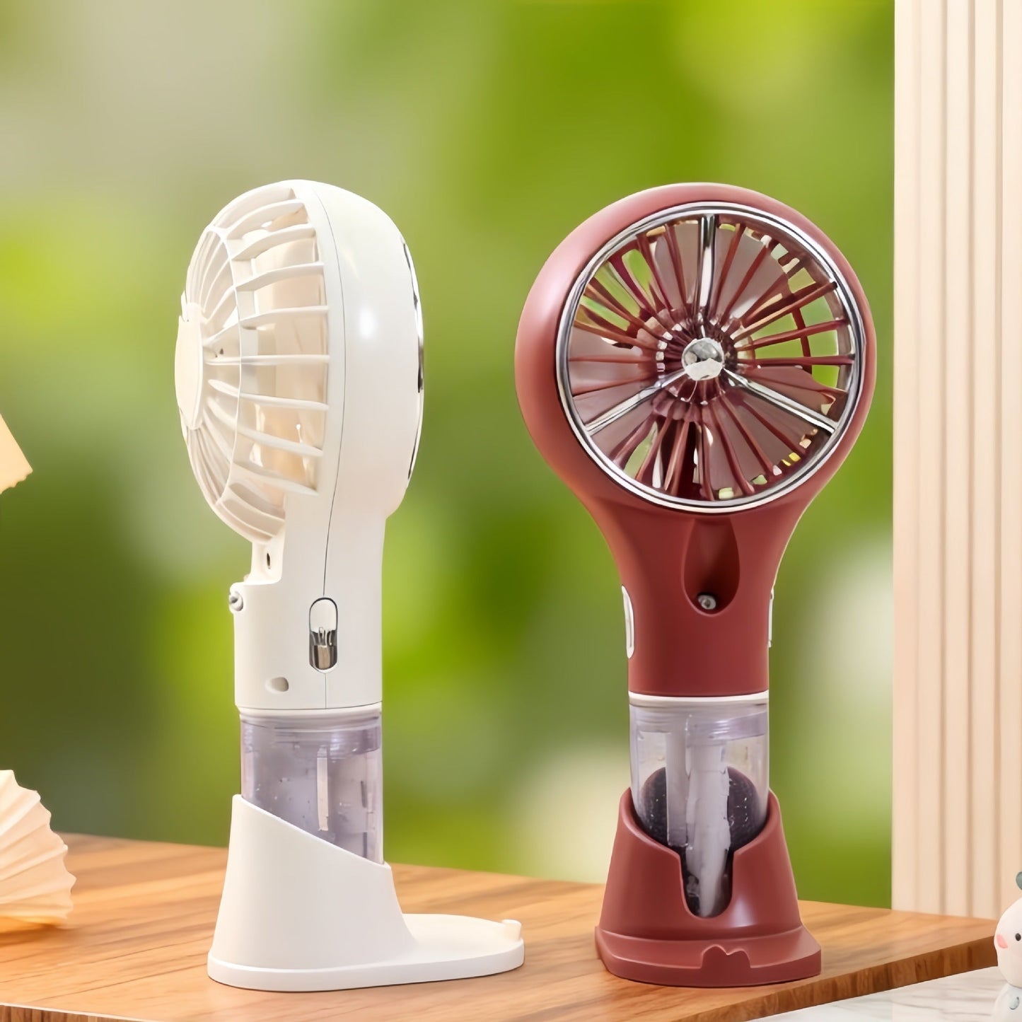 Ventilateur à main brumisateur portable unisexe avec fonction de charge USB et design ergonomique