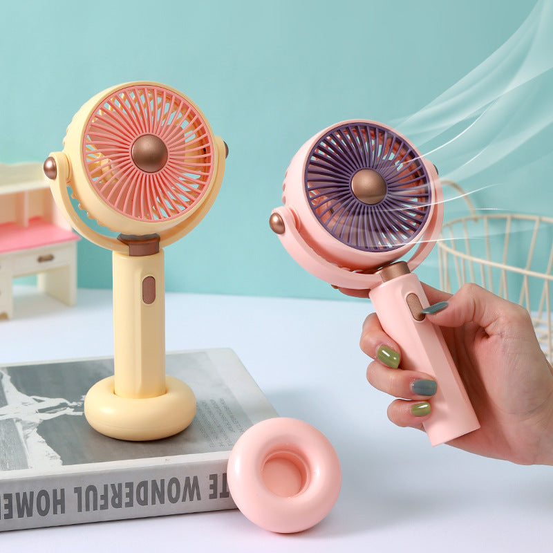Ventilateur à main portable au design ergonomique pour femme